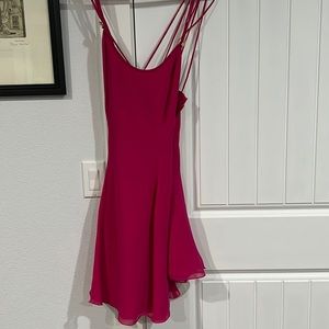 Pretty fushia dress for homecoming or prom, unique design crosses in back.